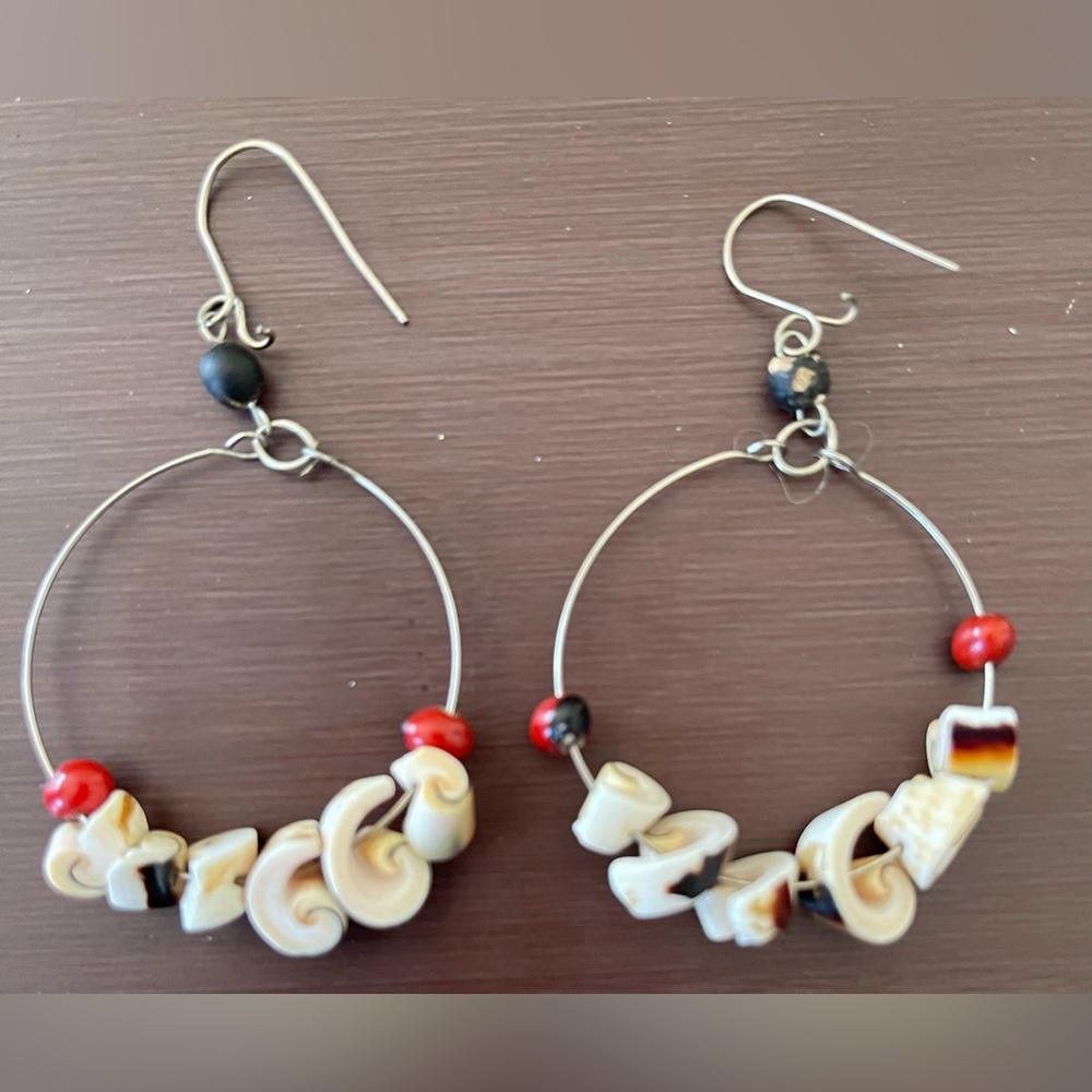 Silver hoop earrings with shell-like beads